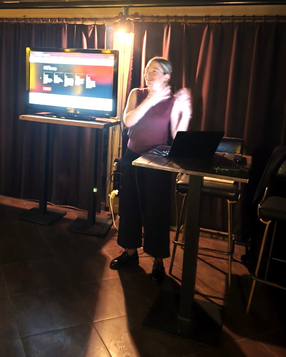 Presenting ICAN Group's service pillars on a screen during the launch evening